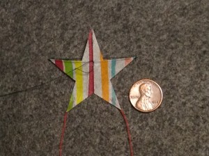2 inch Sotich Star kite, striped cocktail napkin.