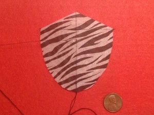 3 inch Sotich Shield kite, cocktail napkin.