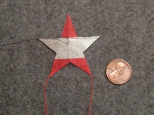 2 inch Sotich Star kite, cocktail napkin.
